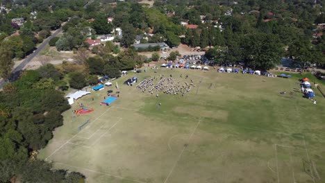 Drone-video-of-a-Group-Exercise-at-a-field-in-Bulawayo,-Zimbabwe
