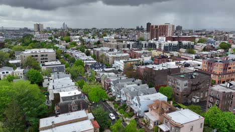 Aerial-of-town-of-Weehawken-New-Jersey-during-thunderstorm-rain-storm-clouds-roll-in