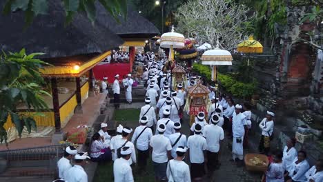 Procession-of-Balinese-People-Walking-on-Temple-Ceremony-Carrying-Umbrellas-and-Offerings,-Cleansing-Ritual-in-Bali-Indonesia,-Hindu-Religion