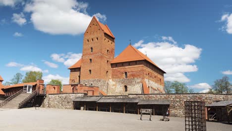 Trakai,-Lithuania-4-May-2023:-Tourists-Visiting-Trakai-Gothic-Island-Castle-Inner-Yard,-Museum-and-a-Cultural-Centre-POV,-Steadicam-Shot