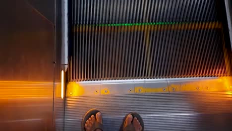 isolated-moving-escalator-going-up-with-passenger-foot-from-top-angle-at-morning-video-is-taken-at-new-delhi-metro-station-new-delhi-india-on-Apr-10-2022