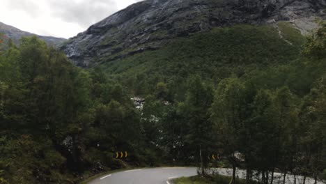 Tilting-camera-view-from-low-angle-of-the-arrival-to-Trollstigen-from-a-bus-in-slow-mo