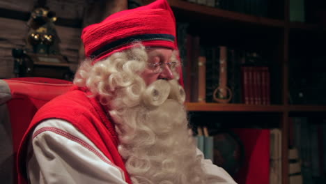 An-interview-with-the-real-Santa-Claus-where-he-gestures-low-while-talking-about-a-past-experience-from-a-long-ago-Chrismas-run