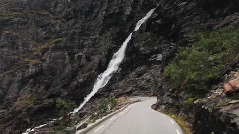Driving-through-the-narrow-roads-of-Trollstigen-with-bikers-on-the-road-in-slow-motion