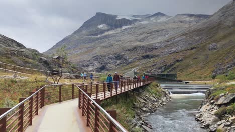 Modern-platorm-of-Trollstigen-with-a-river-on-the-side-and-the-mountains-on-the-background-in-slow-motion