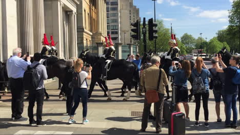 Royal-national-guard-horses-convoy-marching-on-the-streets-of-London-with-spectators-around