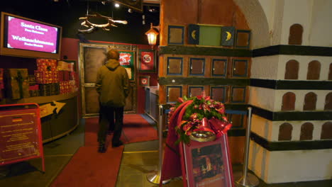 An-eager-old-married-couple-at-the-entry-of-Santa-Claus's-Office-in-Santa-Claus-Village