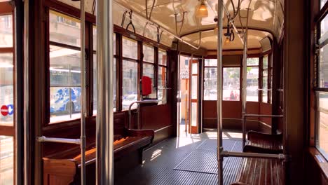 Inside-view-of-vintage-wooden-tram-in-Milan,-Italy,-on-sunny-day