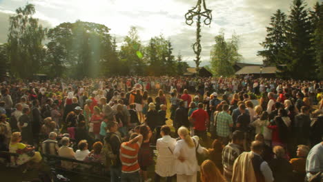 People-of-all-ages-gather-together-and-dance-and-celebrate-the-Midsummer-festival-of-Maypole