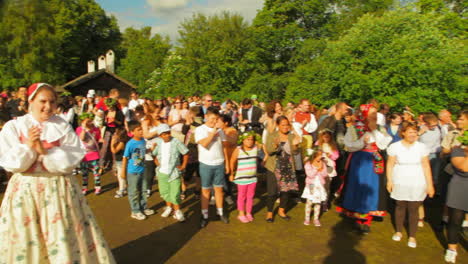 People-of-all-ages-gather-together-and-dance-and-celebrate-the-Midsummer-festival-of-Maypole