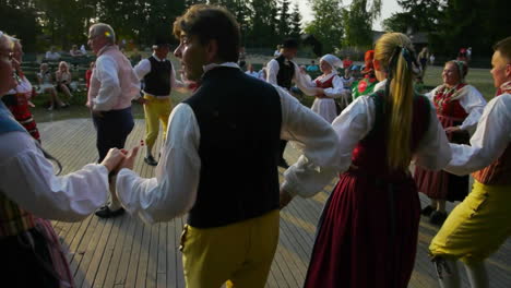 Musicians-play-the-violin-for-the-performance-of-the-traditional-Scandinavian-folk-dance-presented-by-couples-during-Midsummer-in-Sweden