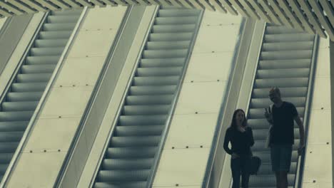 A-Young-Couple-In-An-Downwards-Going-Escalator-In-Subway-Of-Stockholm