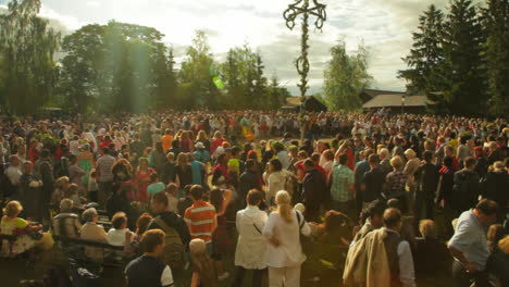 People-of-all-ages-gather-together-and-dance-and-celebrate-the-Midsummer-festival-of-Maypole