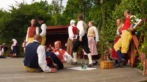 Musicians-play-the-violin-for-the-performance-of-the-traditional-Scandinavian-folk-dance-presented-by-couples-during-Midsummer-in-Sweden
