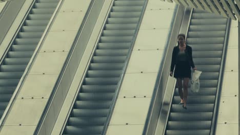 People-In-An-Downwards-Moving-Escalator-At-The-Subway-Station-In-Stockholm