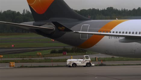 Passenger-aircraft-of-Thomas-Cook-reversing-on-the-runway-of-Stockholm-airport-in-Sweden