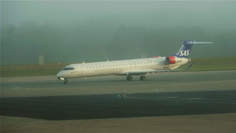 An-airplane-getting-in-position-to-take-off-on-a-foggy-morning-at-Stockholm-Arlanda