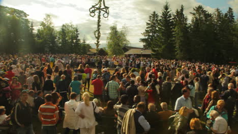 People-of-all-ages-gather-together-and-dance-and-celebrate-the-Midsummer-festival-of-Maypole