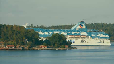 Cineflex-GyroStabilized-shot-of-a-big-ferry-from-Silja-Line-disappearing-behind-an-island-in-the-Nordic-coast