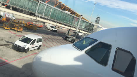 Dutch-Angle-of-people-boarding-an-airplane-through-a-jet-bridge-in-slow-motion