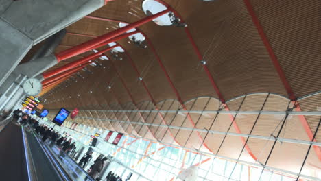 Dutch-angle-of-the-ceiling-of-Madrid-aiport-while-moving-on-a-autowalk-in-slow-motion