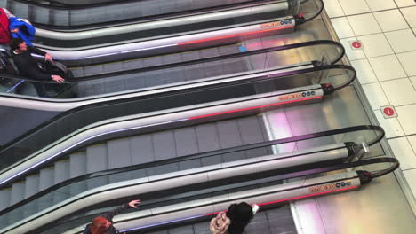 View-from-a-high-angle-of-escalators-in-an-airport-in-slow-motion