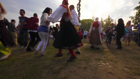 People-of-all-ages-gather-together-and-dance-and-celebrate-the-Midsummer-festival-of-Maypole