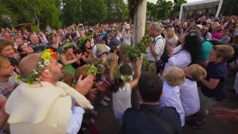 People-of-all-ages-gather-together-and-dance-and-celebrate-the-Midsummer-festival-of-Maypole