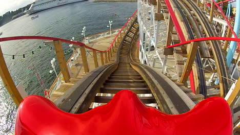 Children-and-enjoy-riding-a-rollercoaster-at-high-speeds-in-an-amusement-park-in-the-summertime