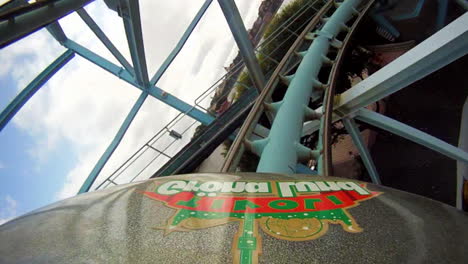 Children-and-enjoy-riding-a-rollercoaster-at-high-speeds-in-an-amusement-park-in-the-summertime