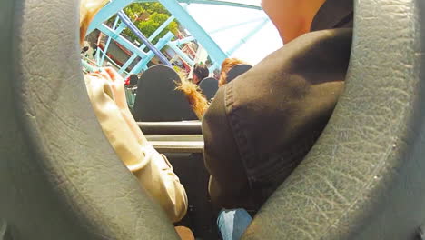 Children-and-enjoy-riding-a-rollercoaster-at-high-speeds-in-an-amusement-park-in-the-summertime