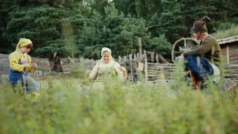 Vikings-socializing-and-interacting-with-each-other-in-a-clam-and-charming-little-village-in-a-viking-age-village-reenactment-in-Sweden