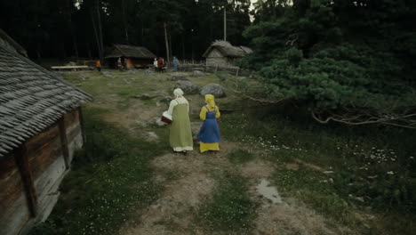 Vikings-socializing-and-practicing-their-sword-skills-with-each-other-in-a-clam-and-charming-little-village-in-a-viking-age-village-reenactment-in-Sweden