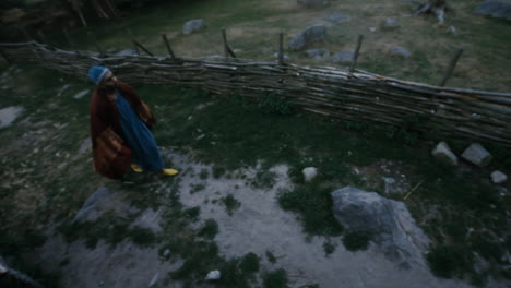 Vikings-socializing-and-practicing-their-sword-skills-with-each-other-in-a-clam-and-charming-little-village-in-a-viking-age-village-reenactment-in-Sweden