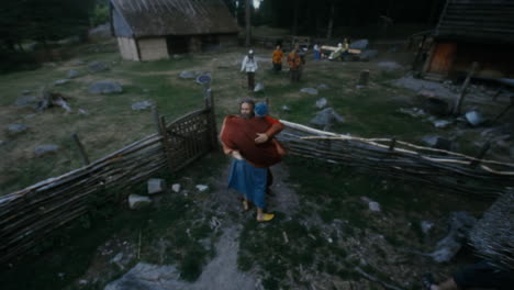 Vikings-socializing-and-practicing-their-sword-skills-with-each-other-in-a-clam-and-charming-little-village-in-a-viking-age-village-reenactment-in-Sweden