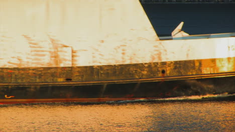Close-up-approach-of-a-moving-ship,-from-a-lateral-point-of-view
