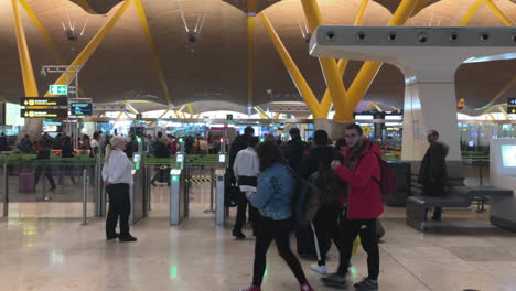 Still-shot-in-slow-motion-of-people-walking-on-a-terminal-of-Madrid-airport