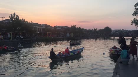 Sunset-boat-ride-down-a-river-in-Da-Nang,-Vietnam