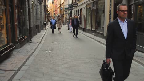 People-Walking-Through-Stockholm's-Scenic-Old-Town-Walking-Street