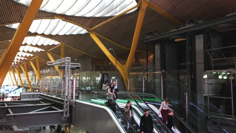 Panoramic-view-of-the-t4-in-Madrid-with-people-using-escalators-in-slow-motion