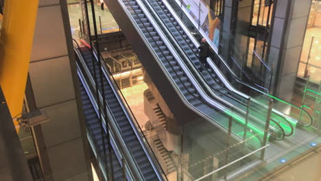 Man-alone-taking-escalators-in-Madrid-airport