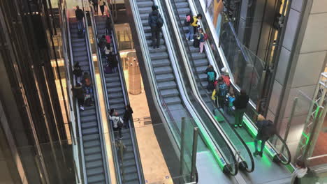 Slow-pan-up-of-big-escalators-in-an-airport