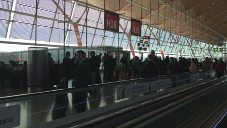 Silhouettes-of-people-waiting-to-on-a-gate-to-get-on-board-of-a-plane