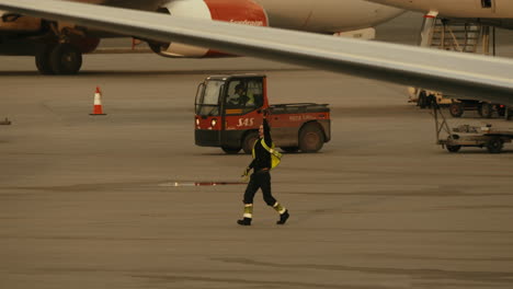 Airport-Staff-Turning-Around-Signing-That-He-Has-The-Ribbon-and-Walking-Away