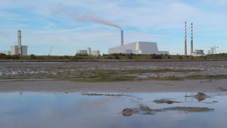 View-across-Dublin-beach-towards-Covanta-waste-to-energy-powerstation