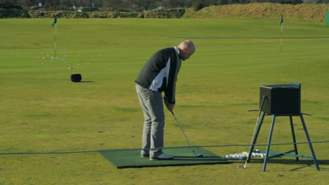 Hobby-golfer-practicing-at-St-Andrews-link-course-in-Scotland