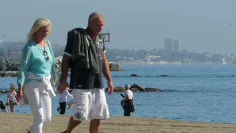 Tourists-enjoying-a-sunny-day-at-Marbella-Beach-SLOMO