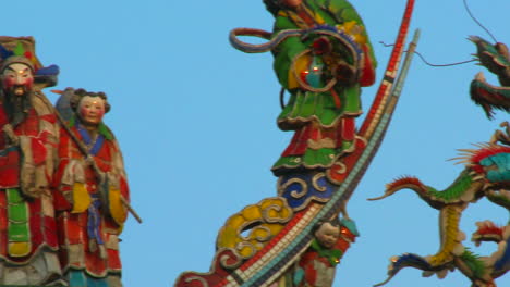 Ornamental-and-colorful-sculpture-of-people-and-dragons-over-temple-in-Taiwan