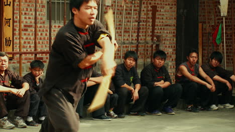 Close-up-Martial-Arts-Warrior-with-Kung-Fu-Staff-Weapon