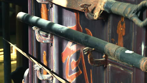 Old-Asian-kung-fu-swords-are-displayed-on-decorative-weapons-rack